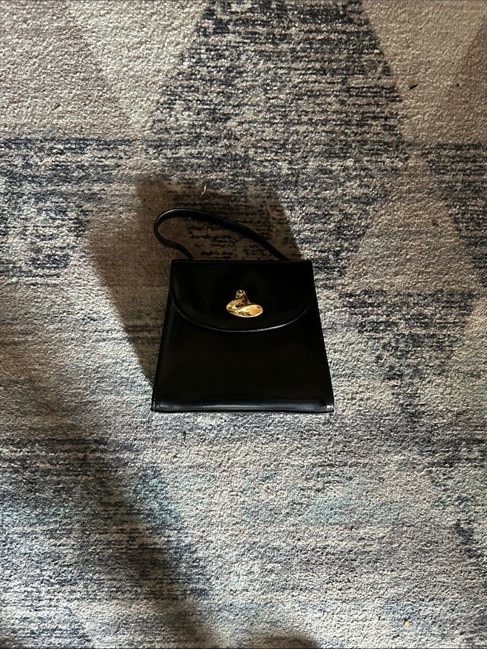 Classic Black Leather Top-Handle Bag with Gold Accent